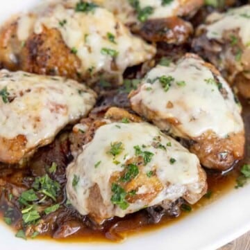 Close up of French Onion Chicken on a white platter.