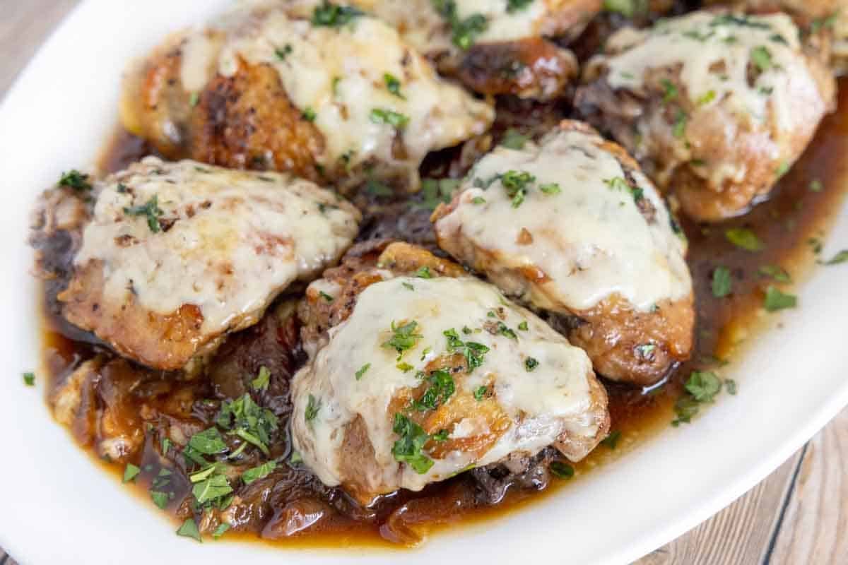 Close up of French Onion Chicken on a white platter.