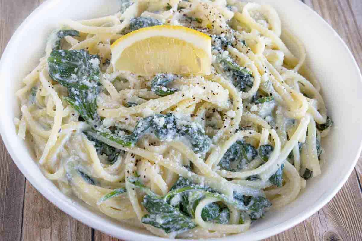 Lemon ricotta pasta in a white bowl.