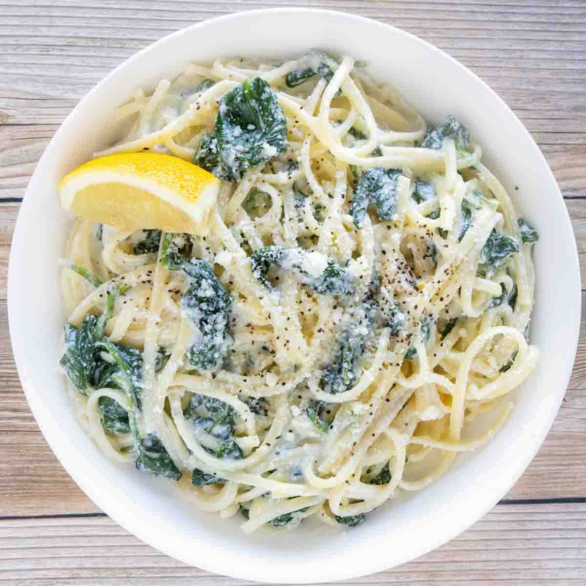 Lemon ricotta pasta in a white bowl.