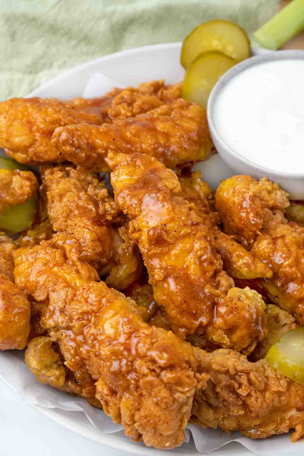 Nashville hot chicken tenders with pickles and bleu cheese dressing.