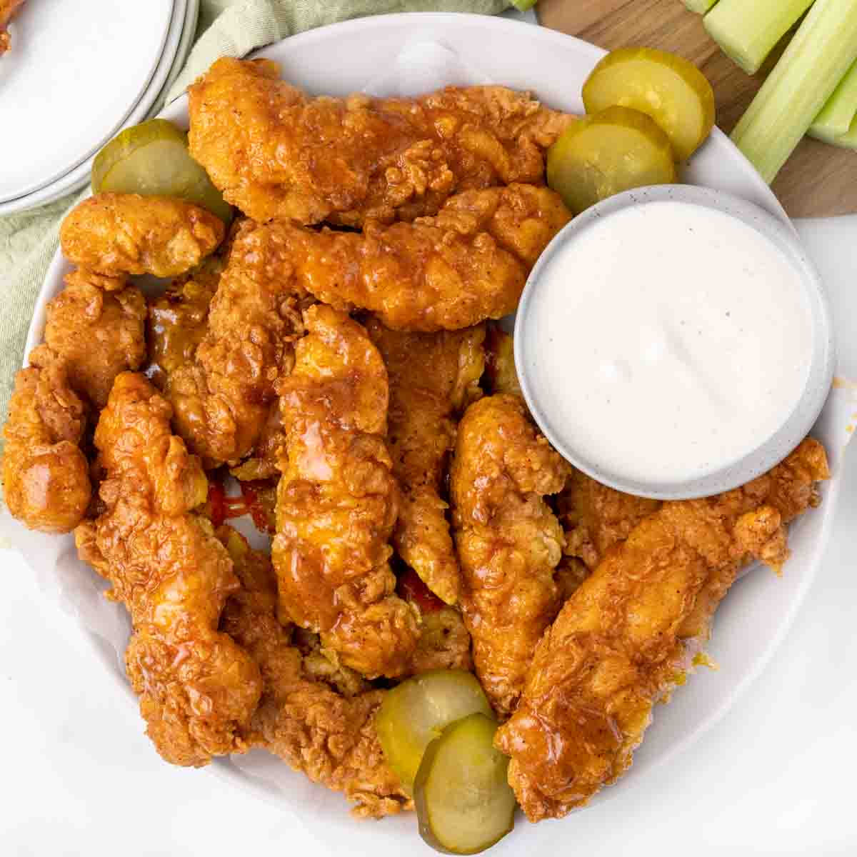 Nashville hot chicken tenders with pickles and bleu cheese dressing.