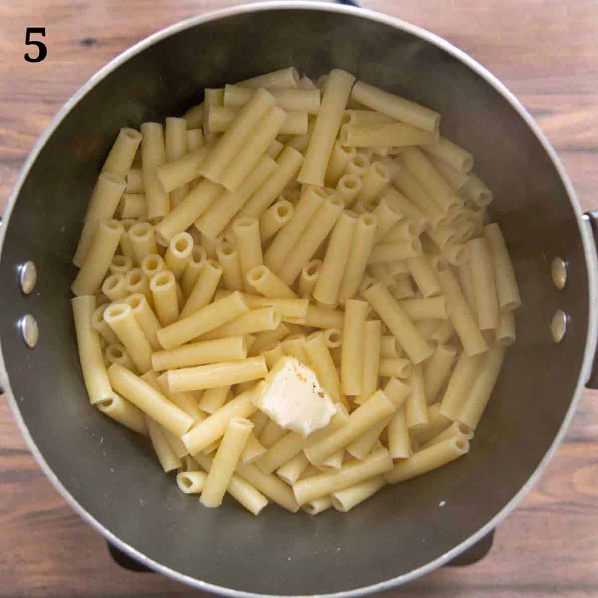 Cooked pasta with butter in the pot.