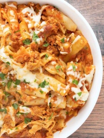 Baked ziti in a white bowl.