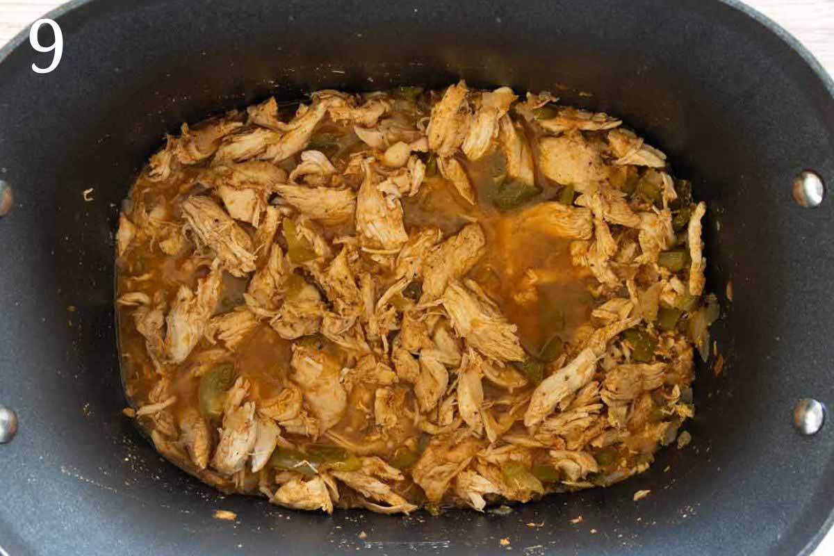Shredded chicken in slow cooker.