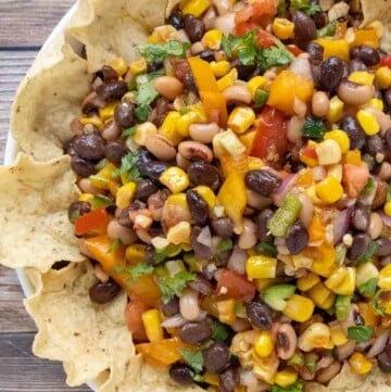 Texas caviar with tortilla chips in a bowl.