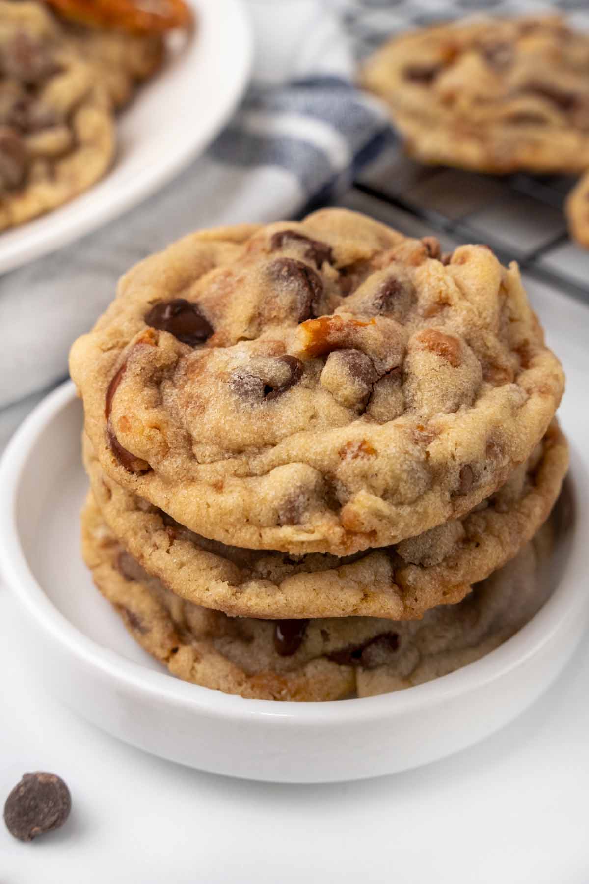 Kitchen sink cookies stacked in a white dish.