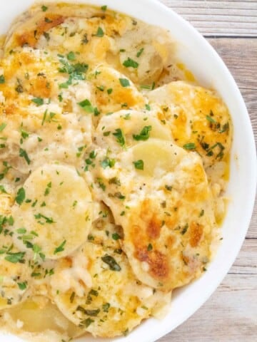 Potatoes au Gratin in a white bowl.