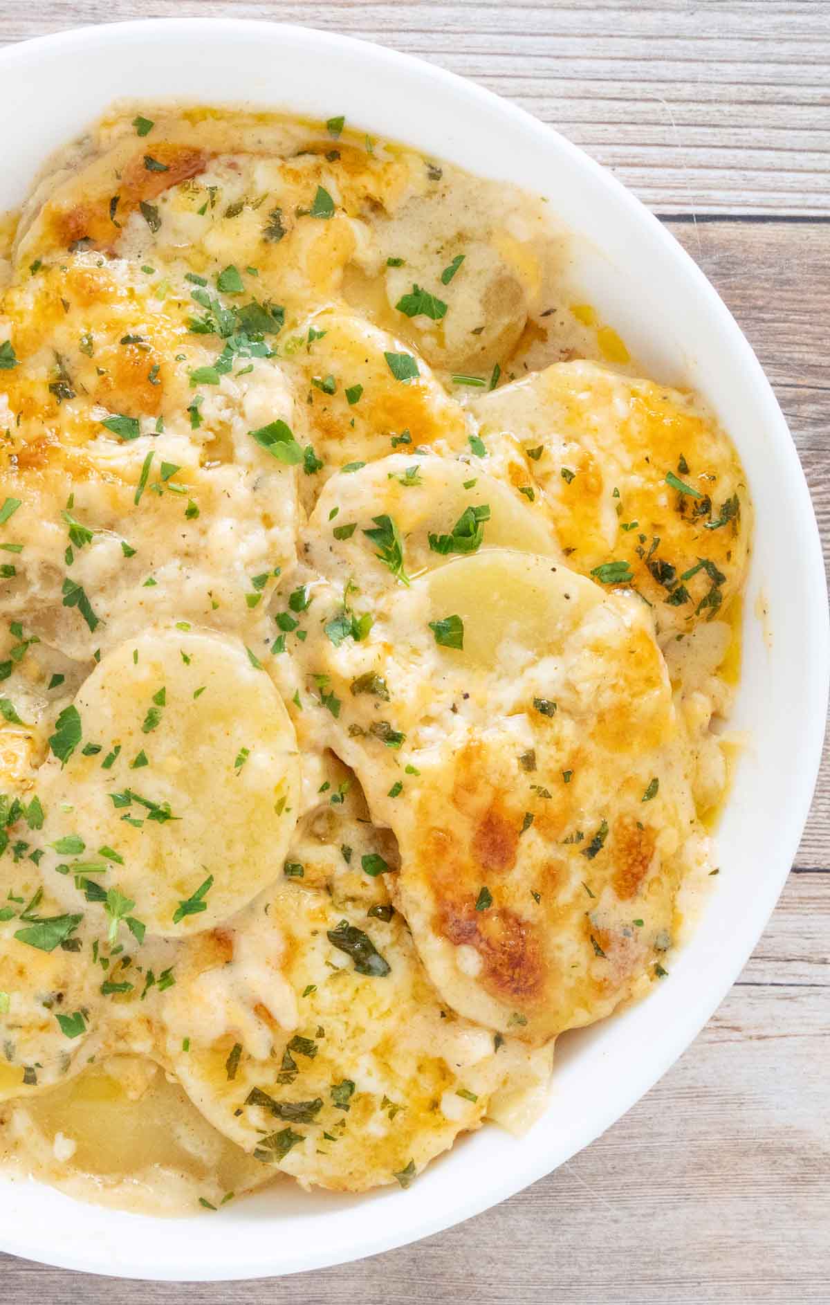 Potatoes au Gratin in a white bowl.