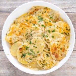 Potatoes au Gratin in a white bowl.