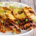 Huli Huli chicken with pineapple and rice on white platter