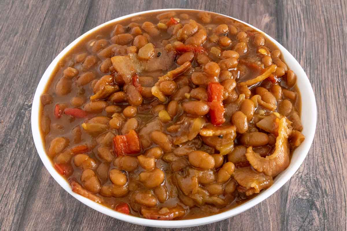 Baked beans in a white bowl.