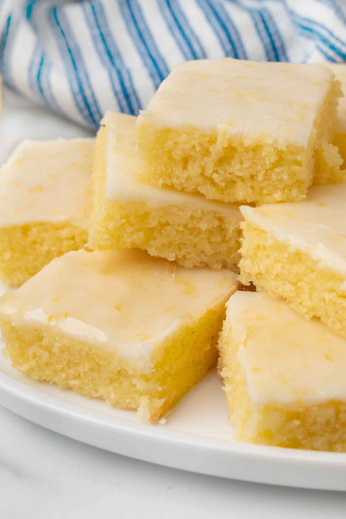 Lemon brownies on a white platter.