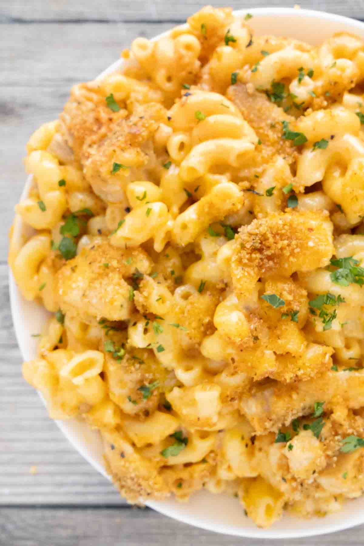 Buffalo chicken macaroni and cheese in a white bowl.