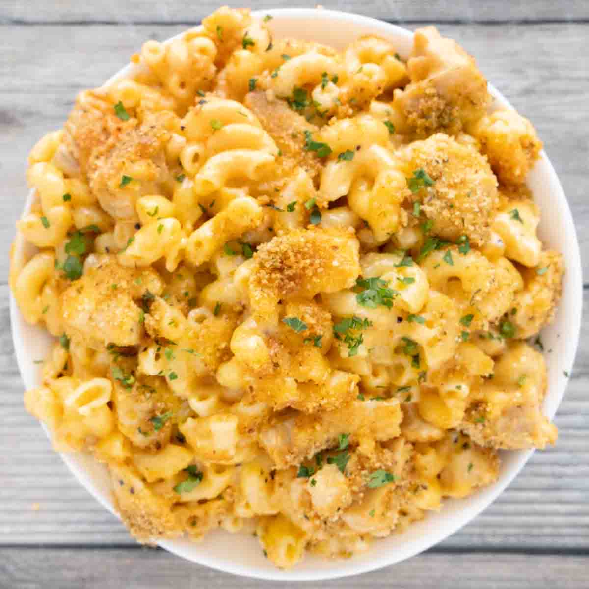 Buffalo chicken macaroni and cheese in a white bowl.