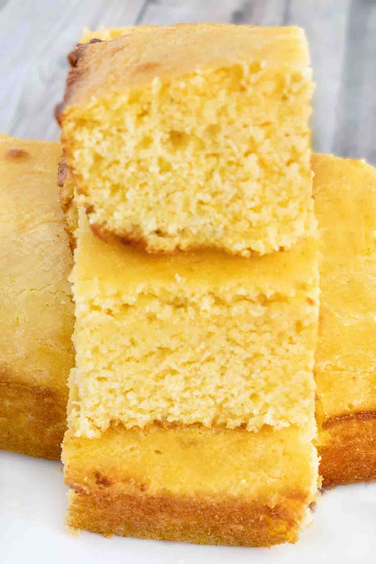 Cornbread stacked on white platter.