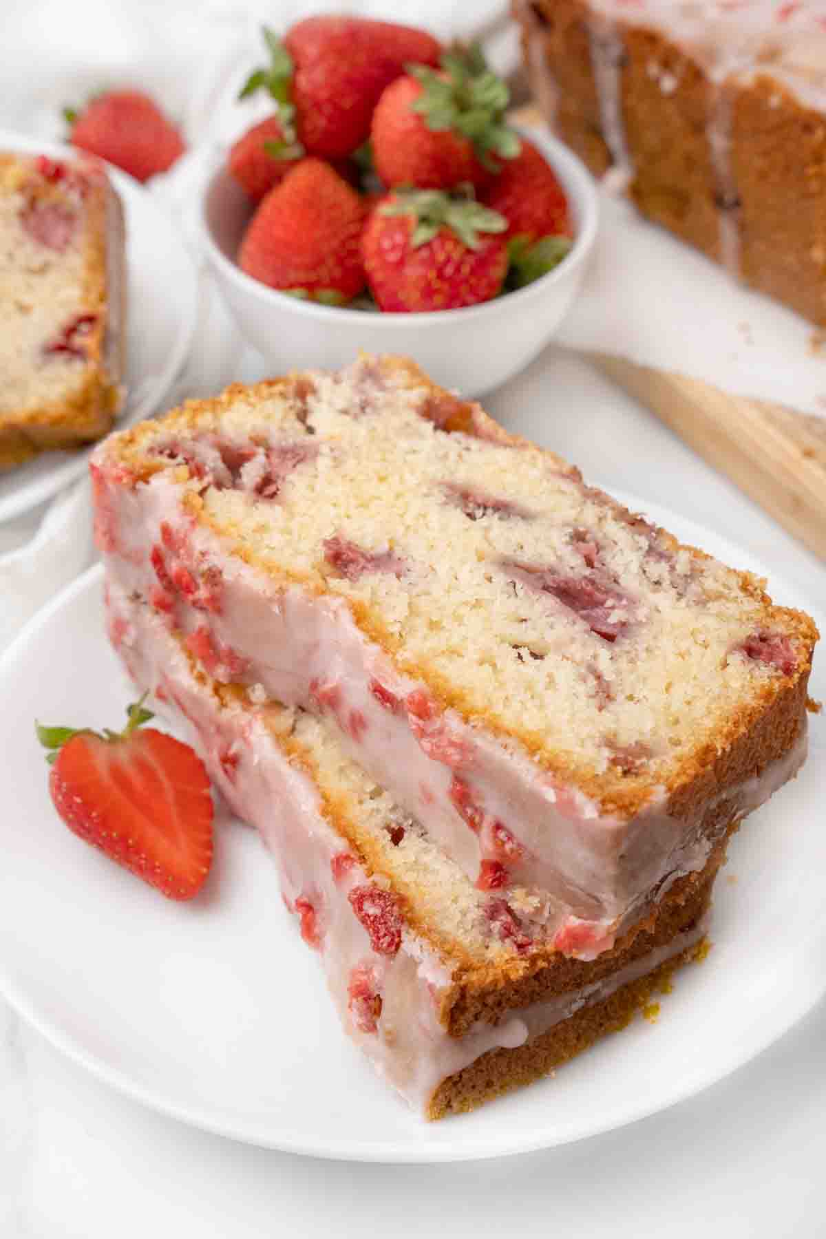 Two slices of strawberry bread on a white plate.
