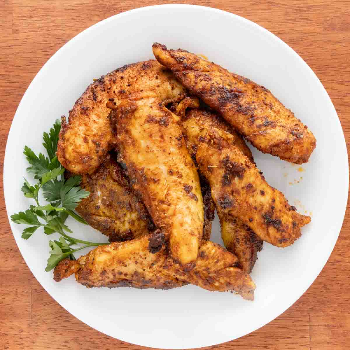 Cooked chicken tenders seasoned with chicken taco seasoning.