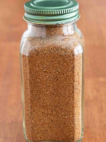 Chicken taco seasoning in a glass jar.