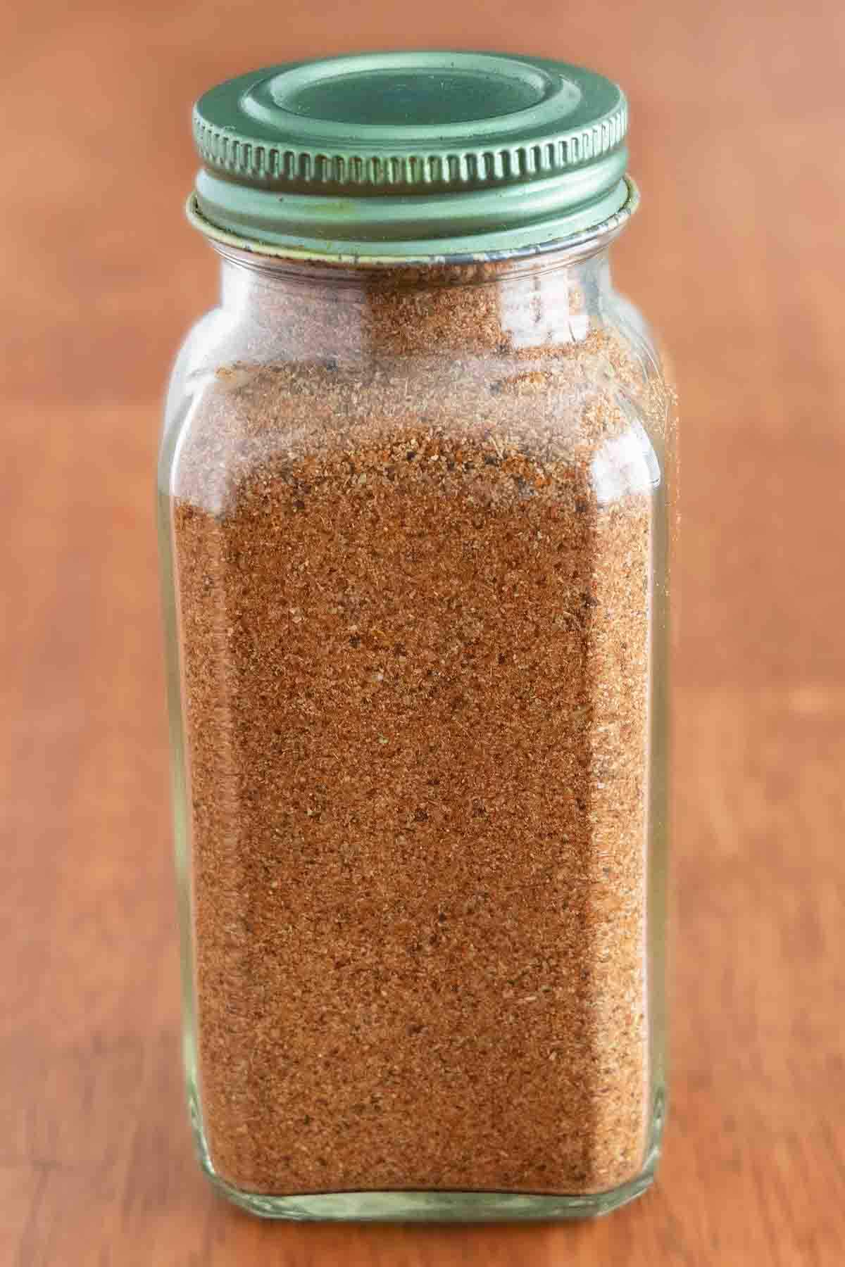 Chicken taco seasoning in a glass jar.