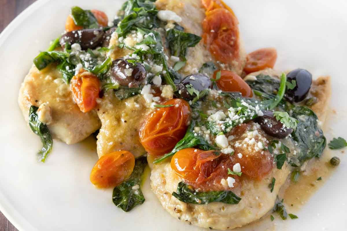Mediterranean chicken on a white plate.