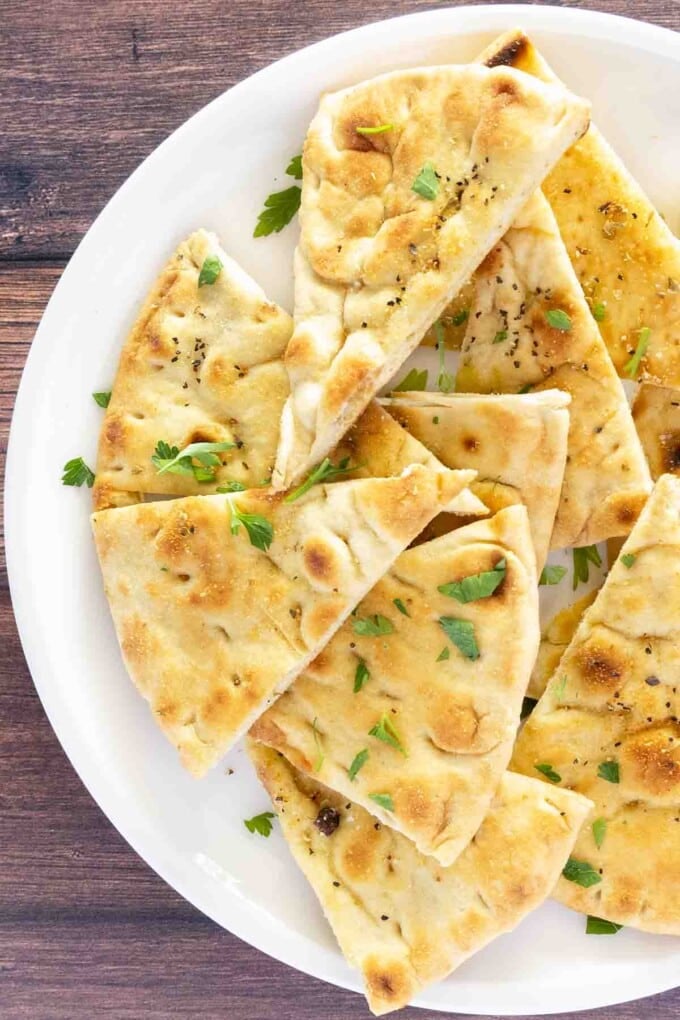 Pita chips on a white plate.