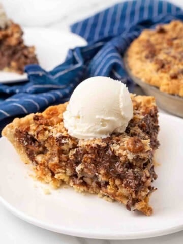 Slice of Texas trash pie on a white plate.