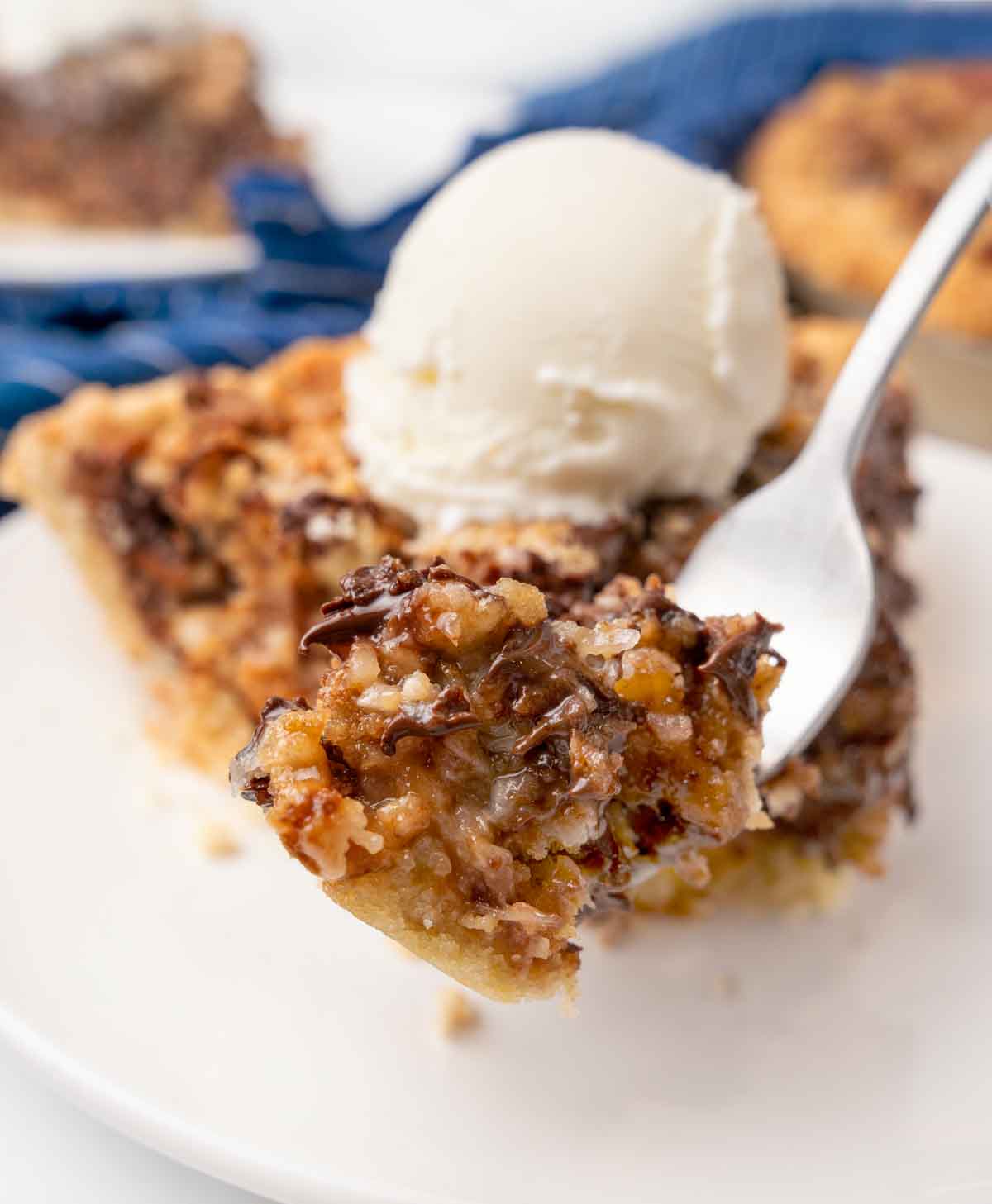 A forkful of Texas Trash Pie in front of the slice.