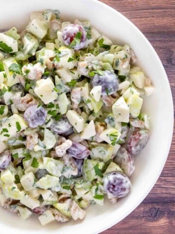 Waldorf salad in a white bowl.