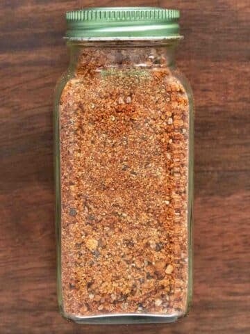 Chicken wing dry rub in a glass jar.