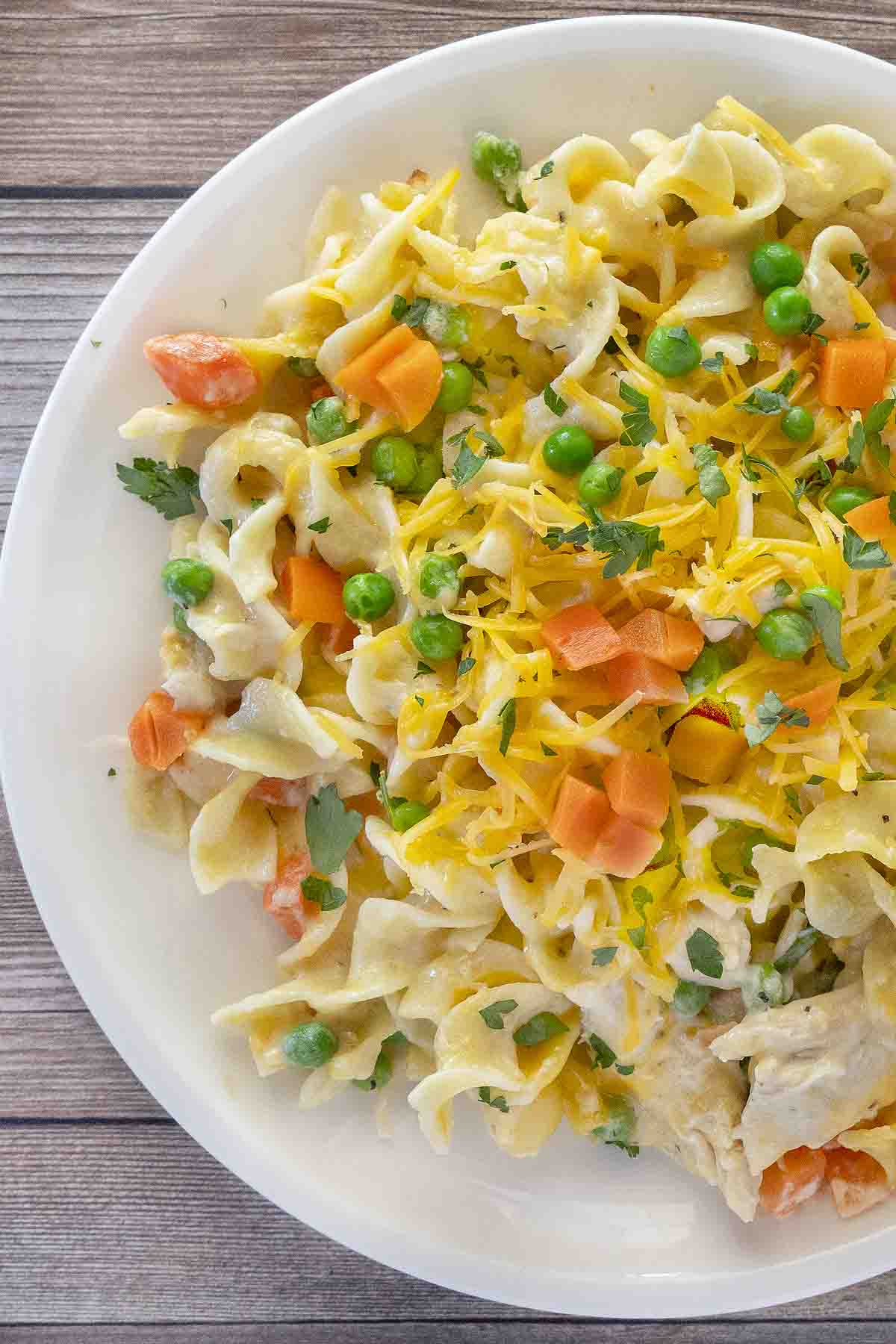 Chicken noodle casserole in a white bowl.