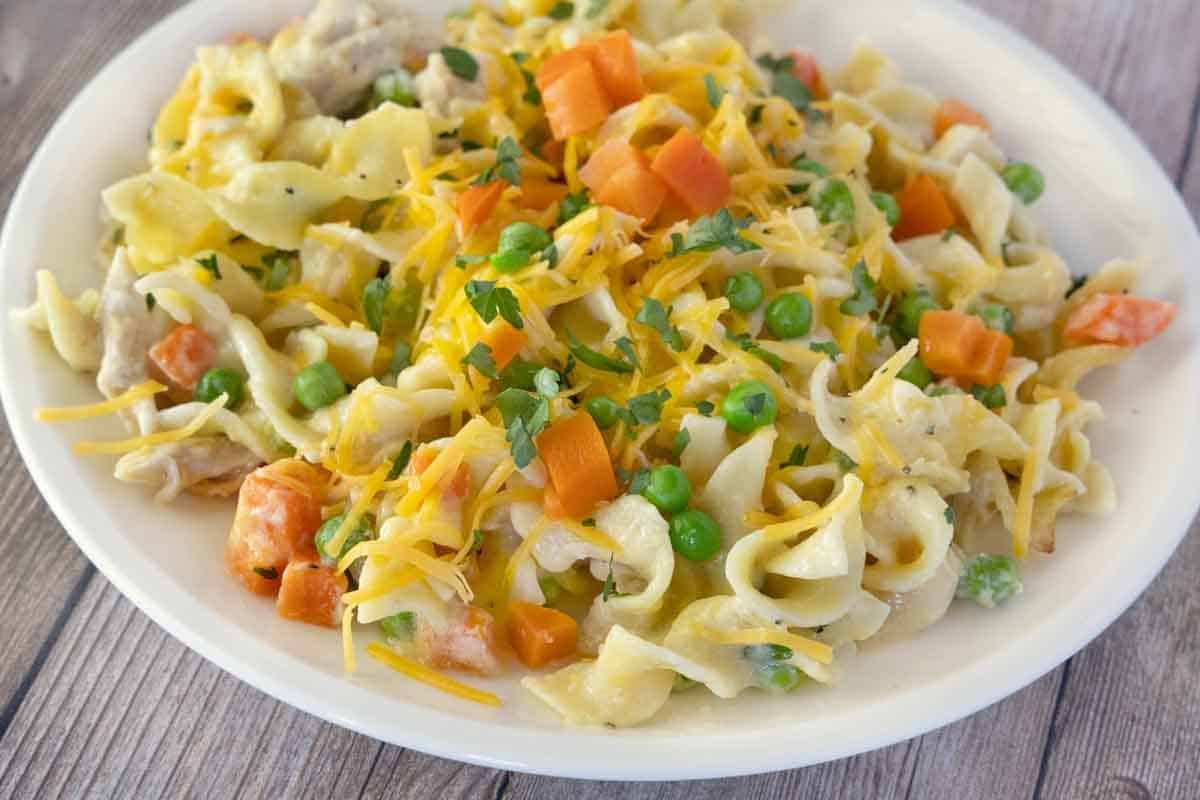 Chicken noodle casserole in a white bowl.