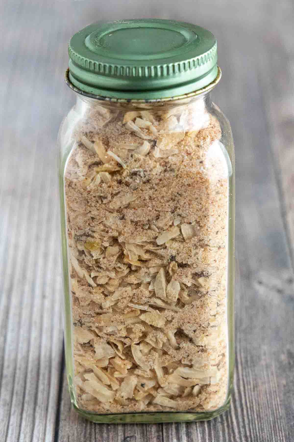 Lipton French onion soup mix in a glass spice jar.