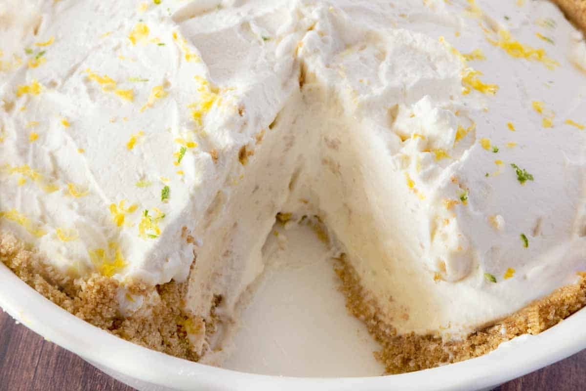 Lemon icebox pie with a slice ou t.