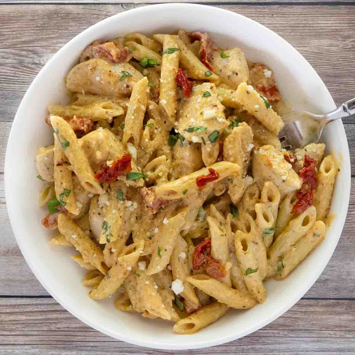 Marry me chicken pasta in a white bowl.