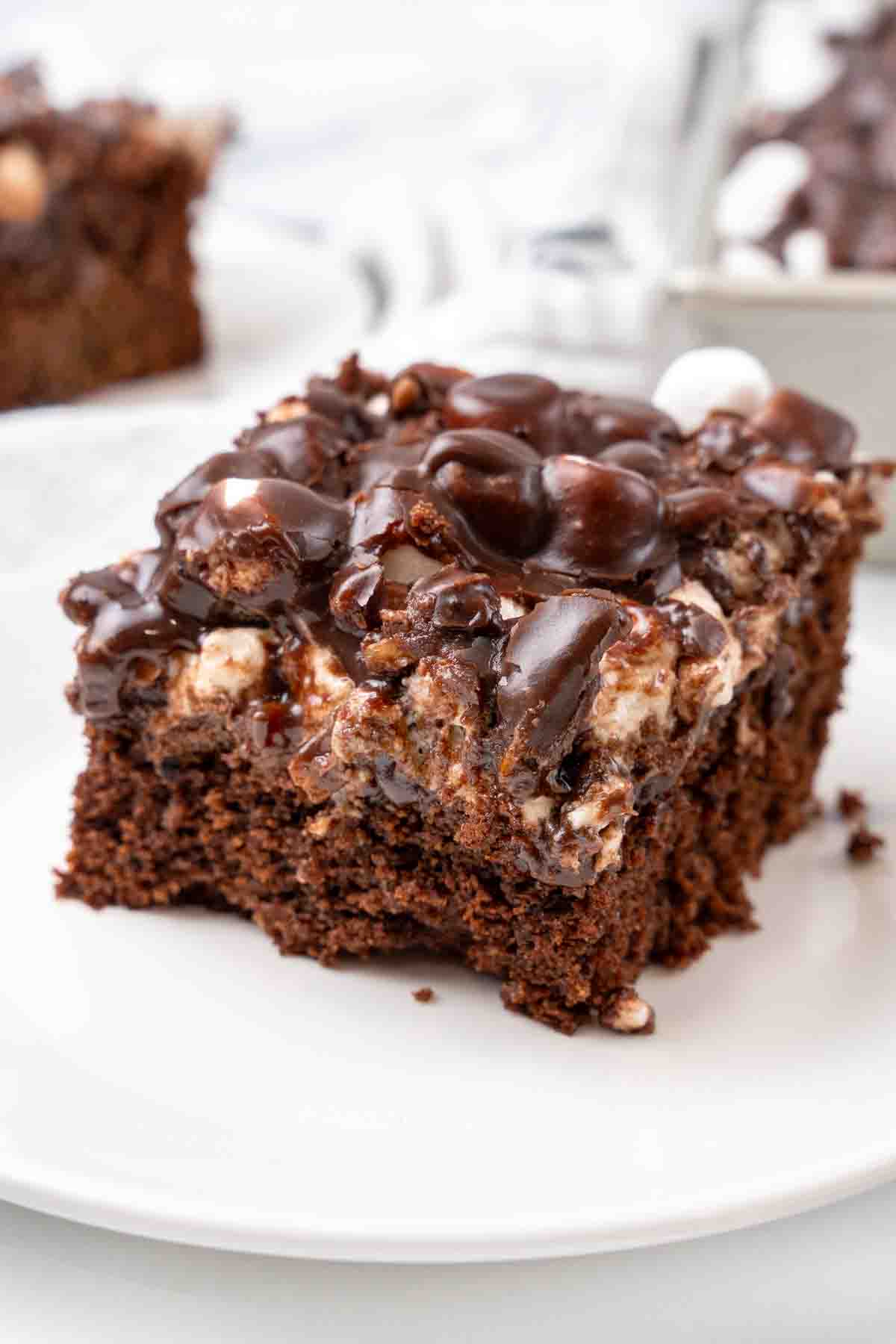Slice of Mississippi mud cake on a white plate.