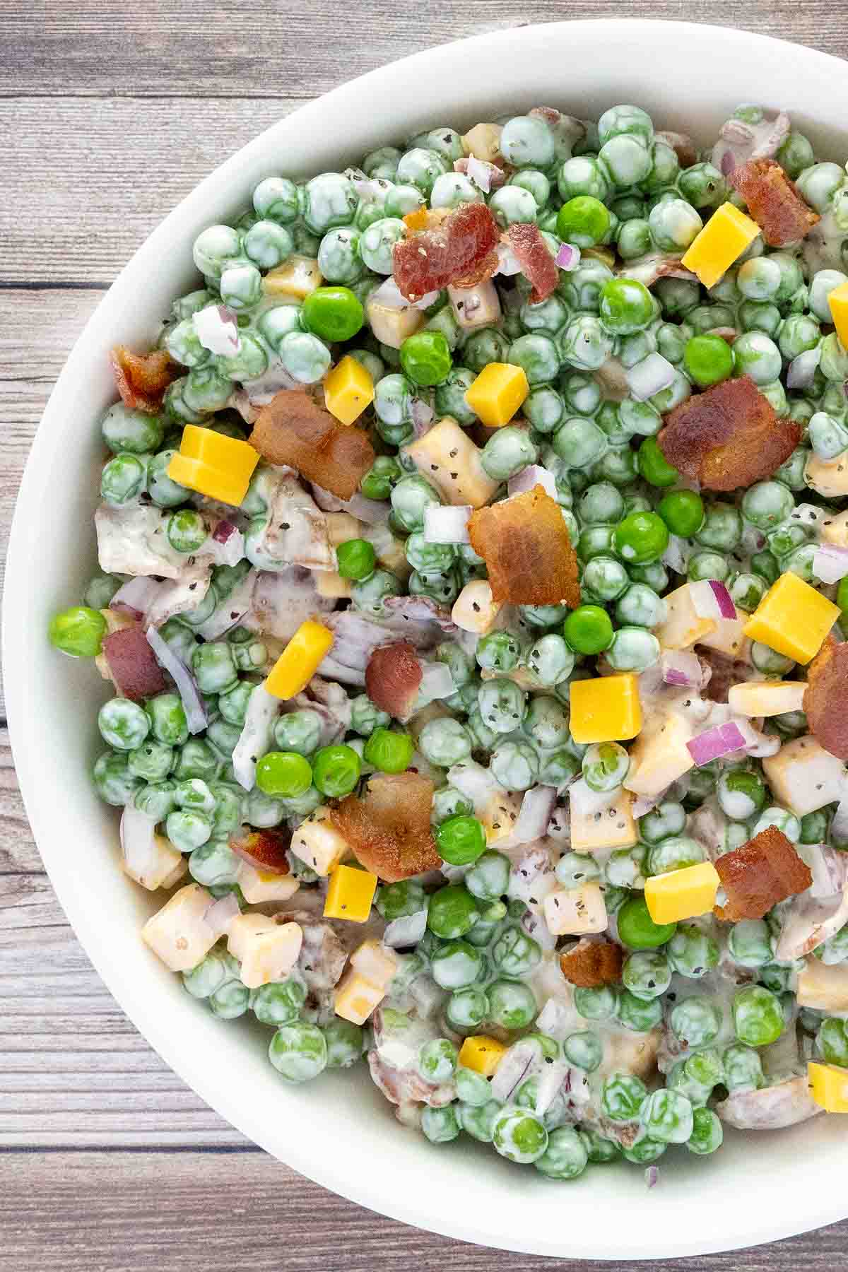 Green Pea Salad in a white bowl.