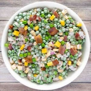 Green Pea Salad in a white bowl.
