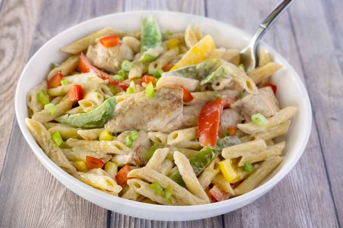 Rastafarian pasta in a white bowl.