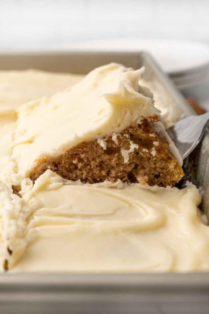 Applesauce cake being taken out of the pan.
