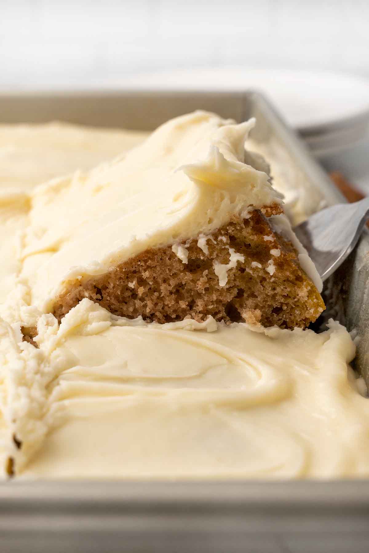 Applesauce cake being taken out of the pan.