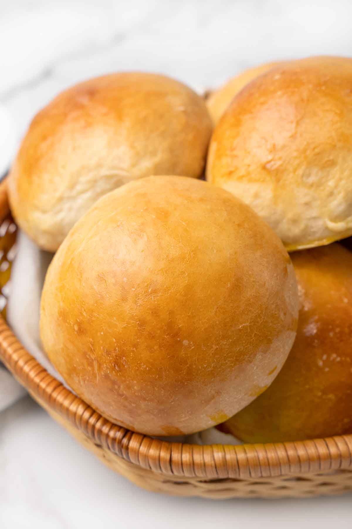 Brioche buns in a basket.