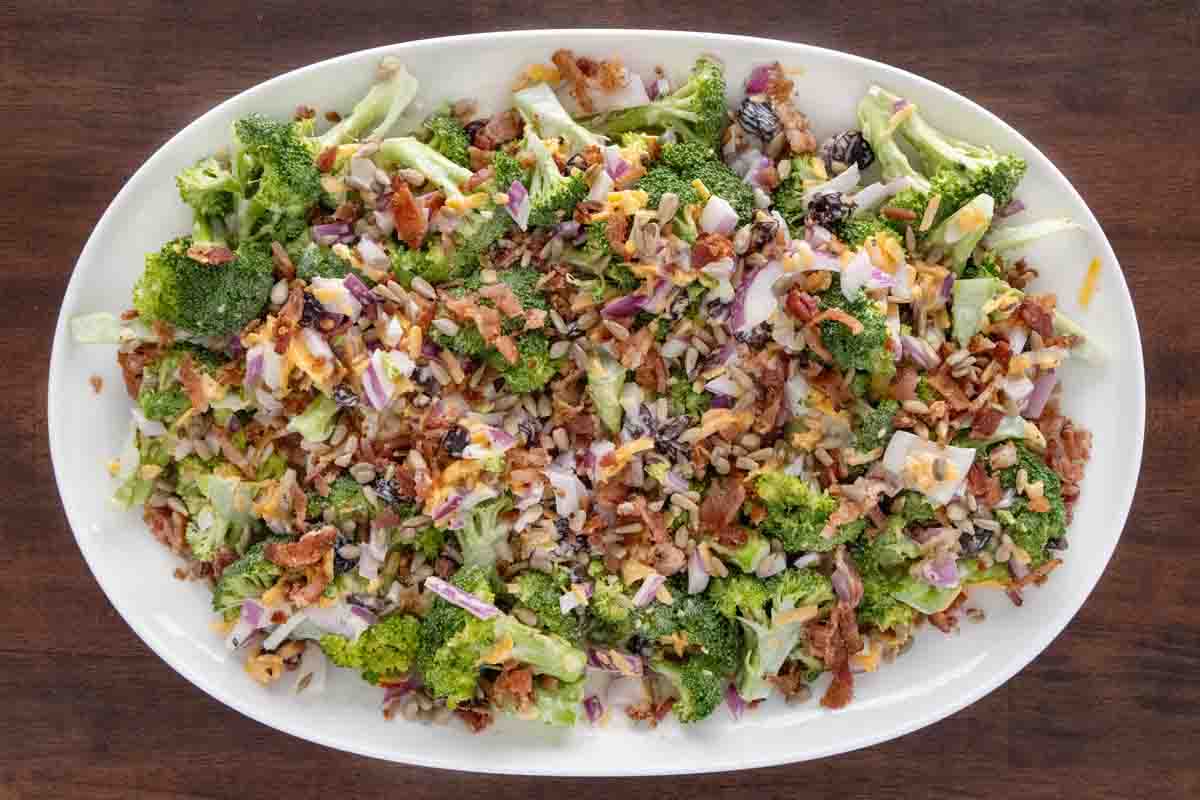 Broccoli salad on a white platter.