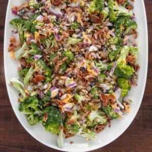 Broccoli salad on a white platter.
