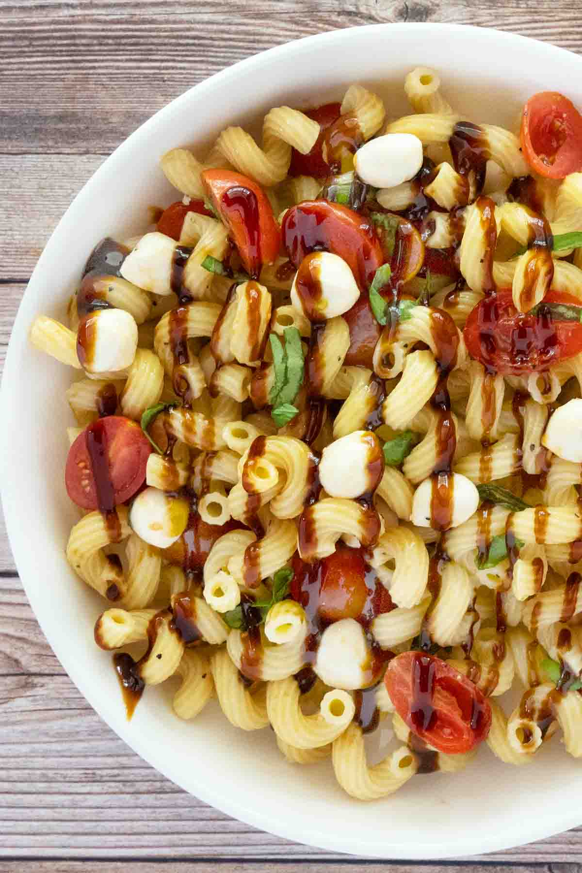 Caprese Pasta Salad in a white bowl.