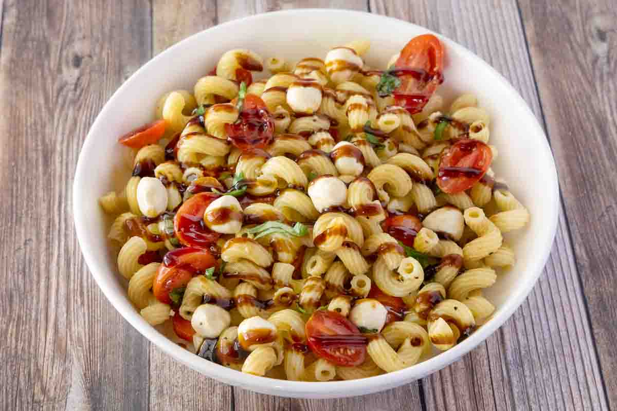 Caprese Pasta Salad in a white bowl.