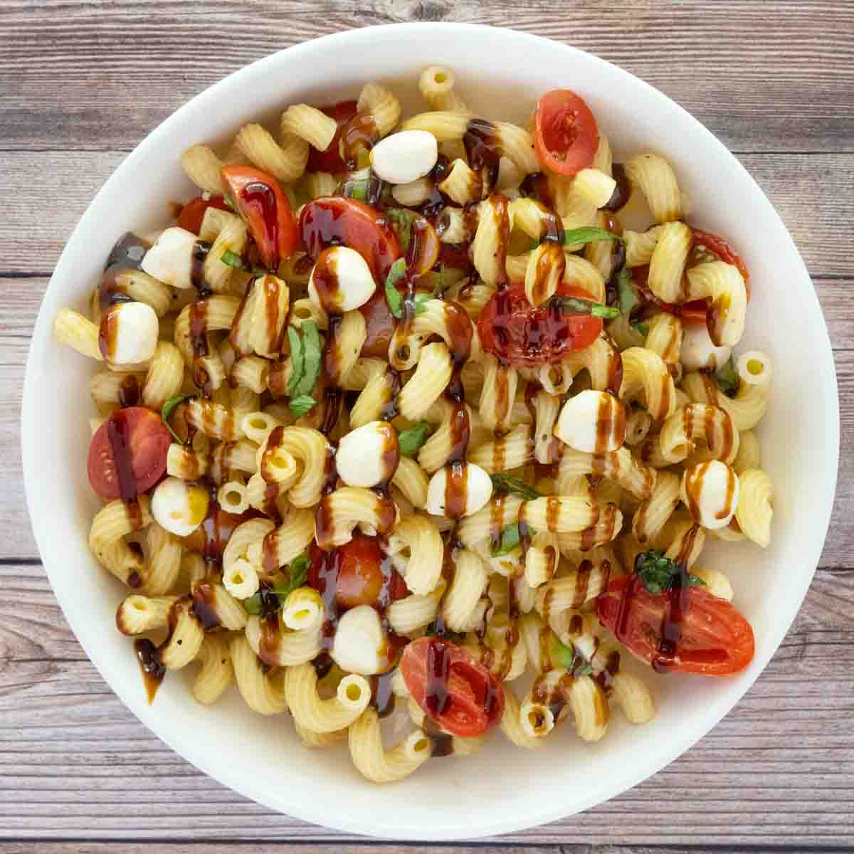 Caprese Pasta Salad in a white bowl.