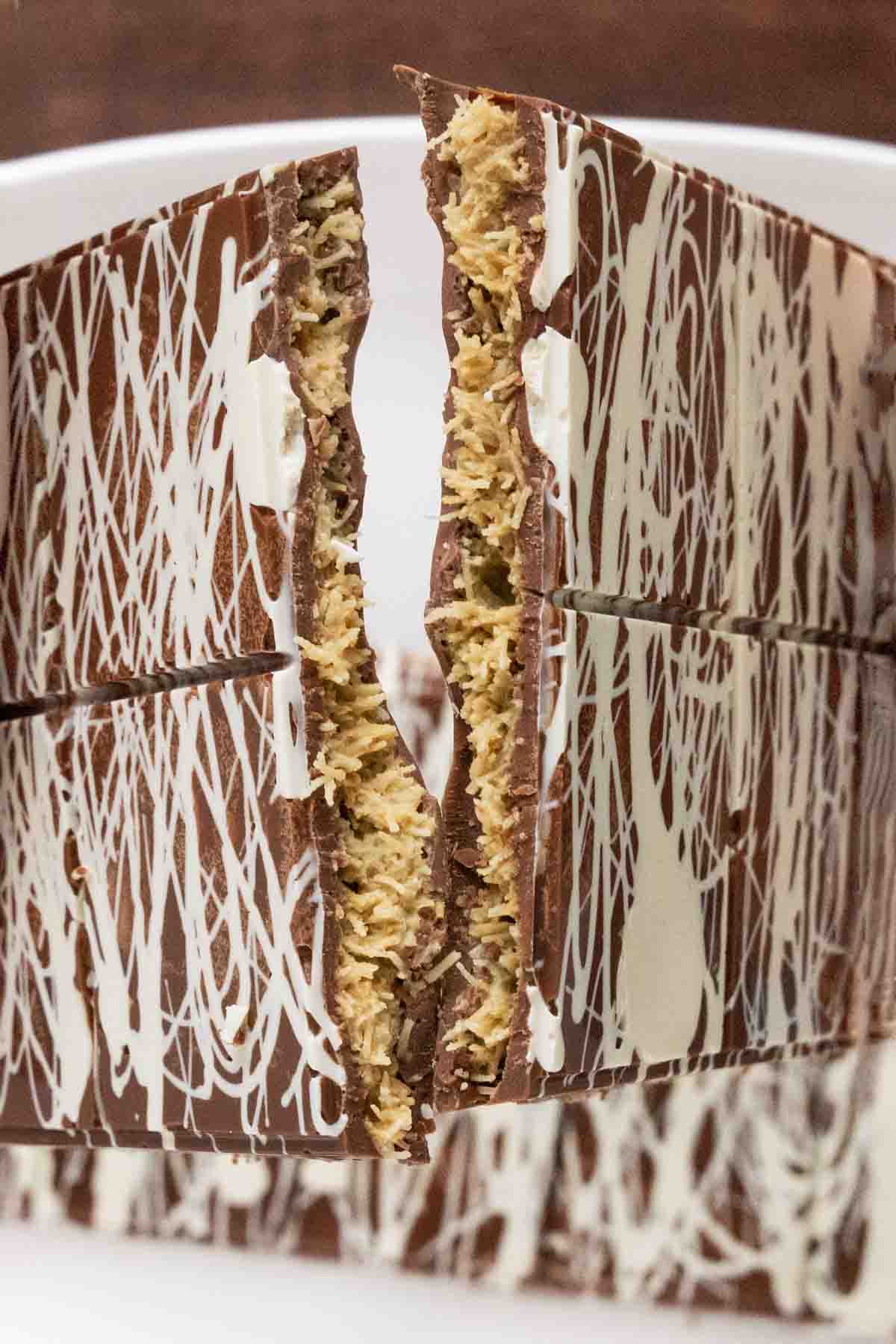 Dubai Bars cracked in half over a white platter.