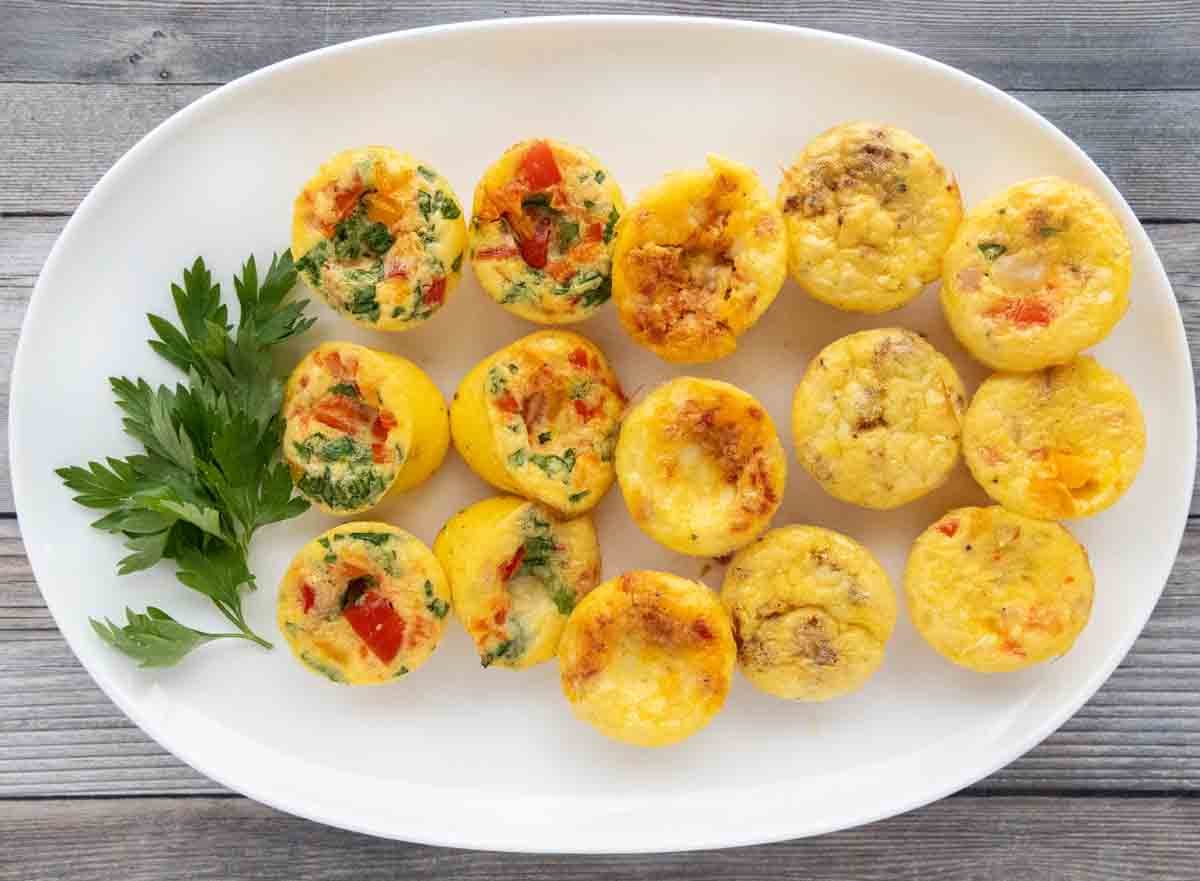 Rows of egg bites on a white platter.
