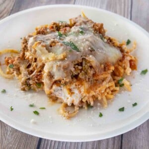 Portion of million dollar spaghetti on a white plate.